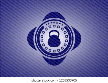 kettlebell icon inside emblem with jean background