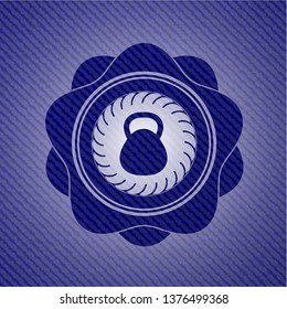 kettlebell icon inside emblem with jean texture