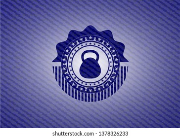 kettlebell icon inside emblem with jean texture
