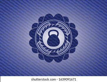 kettlebell icon inside emblem with jean texture
