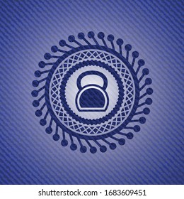 kettlebell icon inside emblem with jean high quality background