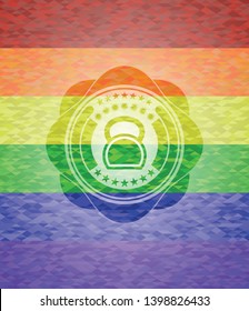 kettlebell icon inside emblem on mosaic background with the colors of the LGBT flag