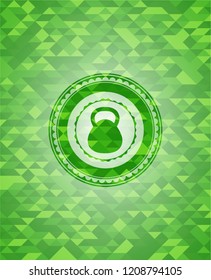 kettlebell icon inside green emblem with mosaic ecological style background