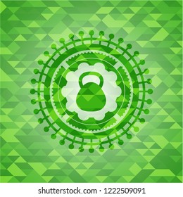 kettlebell icon inside green emblem. Mosaic background