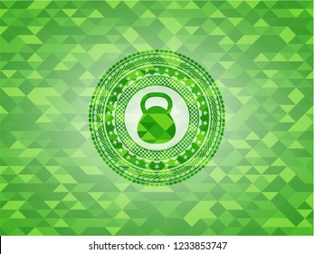kettlebell icon inside green emblem with mosaic background