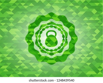 kettlebell icon inside green emblem with mosaic background