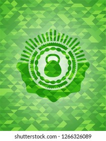 kettlebell icon inside green emblem with triangle mosaic background