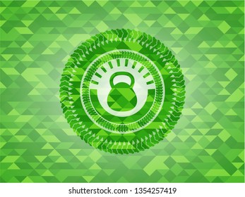  kettlebell icon inside green emblem with triangle mosaic background