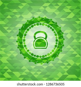 kettlebell icon inside green mosaic emblem