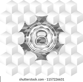 kettlebell icon inside grey badge with geometric cube white background