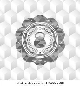 kettlebell icon inside grey badge with geometric cube white background