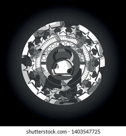 kettlebell icon inside grey camo emblem