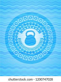 kettlebell icon inside light blue water style emblem.