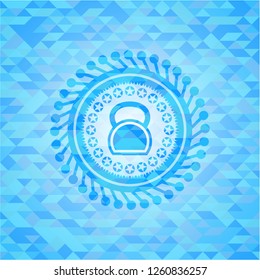 kettlebell icon inside light blue emblem with triangle mosaic background