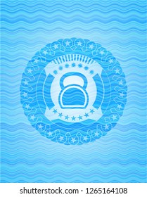 kettlebell icon inside light blue water badge background.