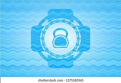 kettlebell icon inside light blue water emblem background.