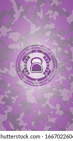 kettlebell icon inside pink camouflage emblem