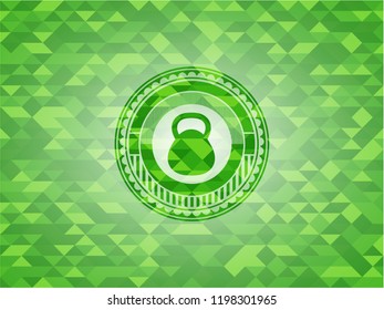 kettlebell icon inside realistic green mosaic emblem