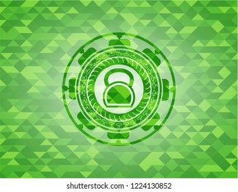 kettlebell icon inside realistic green emblem. Mosaic background