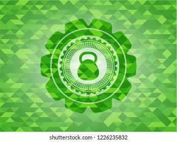 kettlebell icon inside realistic green emblem. Mosaic background