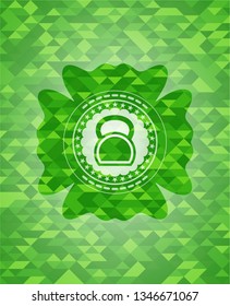kettlebell icon inside realistic green emblem. Mosaic background