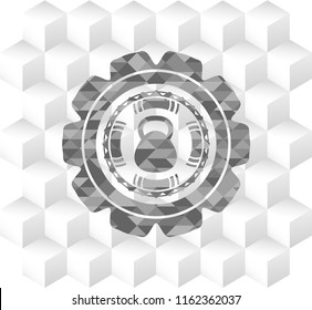 kettlebell icon inside realistic grey emblem with cube white background