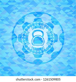 kettlebell icon inside realistic light blue mosaic emblem