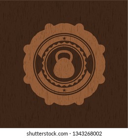 kettlebell icon inside realistic wooden emblem