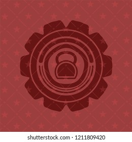 kettlebell icon inside red icon or emblem