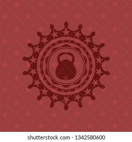 kettlebell icon inside red emblem