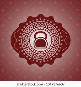 kettlebell icon inside red icon or emblem