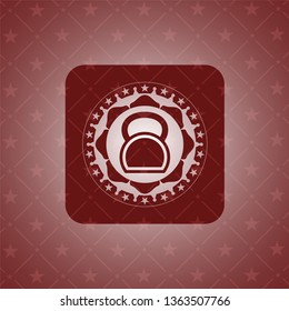 kettlebell icon inside red icon or emblem