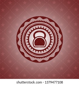 kettlebell icon inside red emblem
