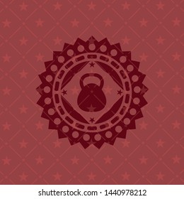 kettlebell icon inside red emblem