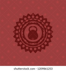 kettlebell icon inside retro style red emblem