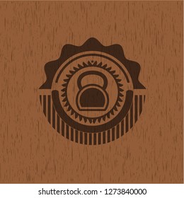 kettlebell icon inside retro style wooden emblem