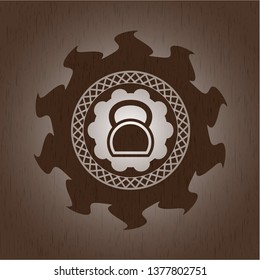 kettlebell icon inside retro style wooden emblem