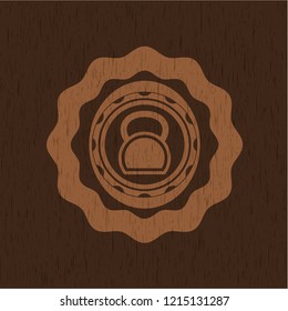 kettlebell icon inside retro wood emblem