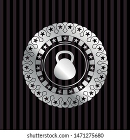 kettlebell icon inside silver badge