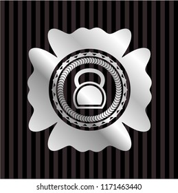 kettlebell icon inside silver emblem or badge