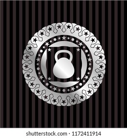 kettlebell icon inside silver emblem