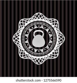 kettlebell icon inside silver emblem