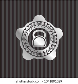 kettlebell icon inside silver emblem