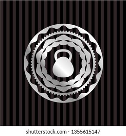 kettlebell icon inside silver emblem or badge
