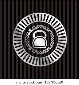 kettlebell icon inside silver emblem or badge