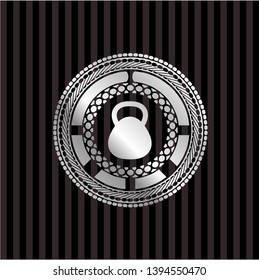 kettlebell icon inside silver shiny emblem