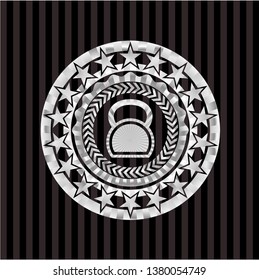 kettlebell icon inside silvery badge