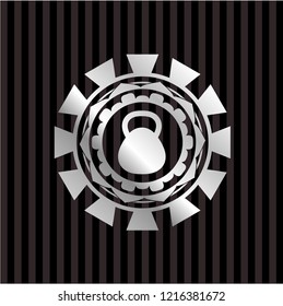 kettlebell icon inside silvery emblem