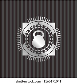kettlebell icon inside silvery shiny emblem