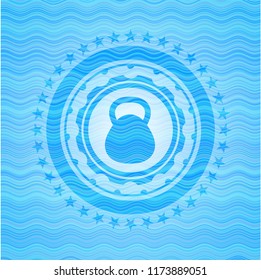 kettlebell icon inside sky blue water wave badge.